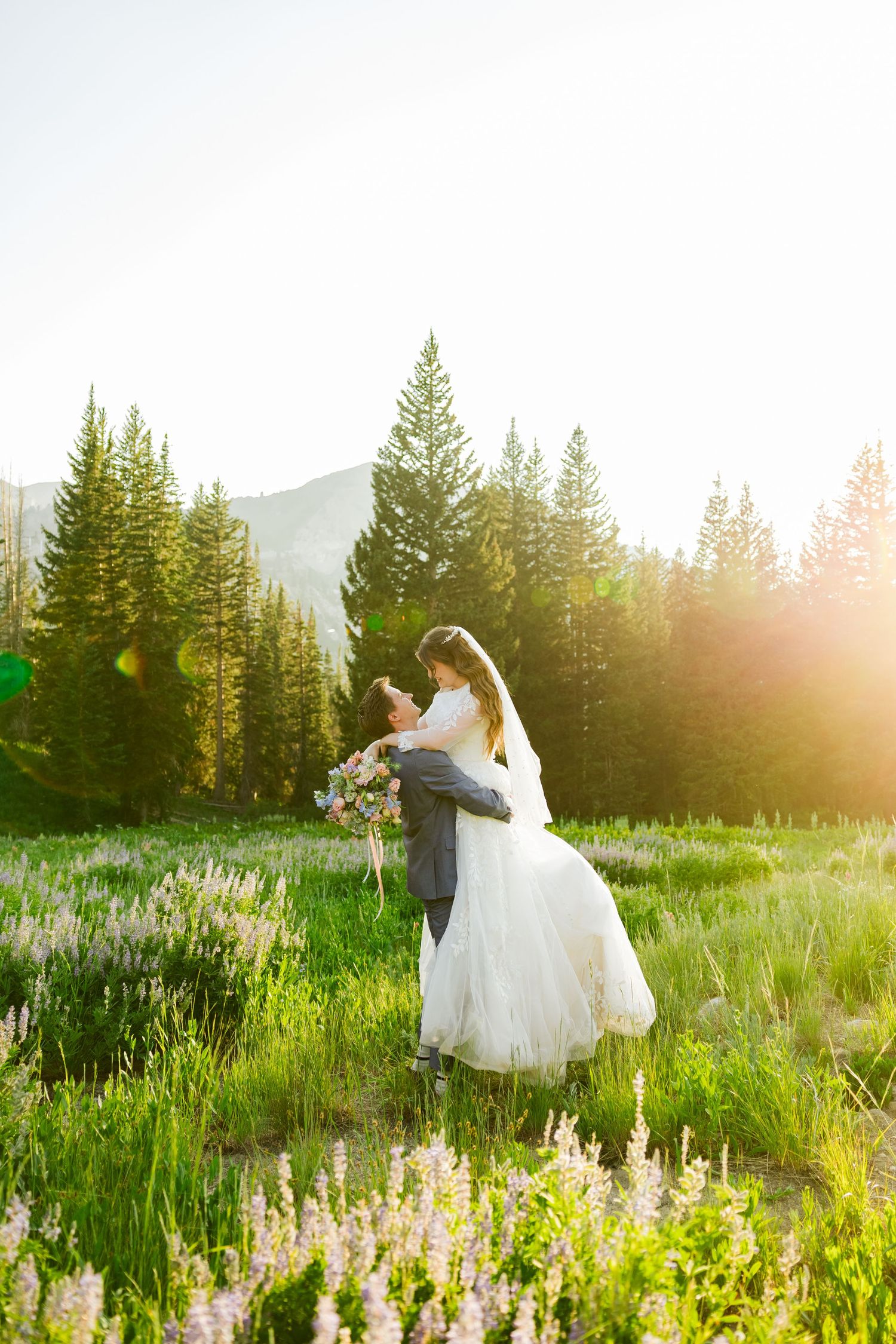 Bride and groom in flower field at Albion Basin photography by Av Potter Photo a Utah wedding and lifestyle photographer