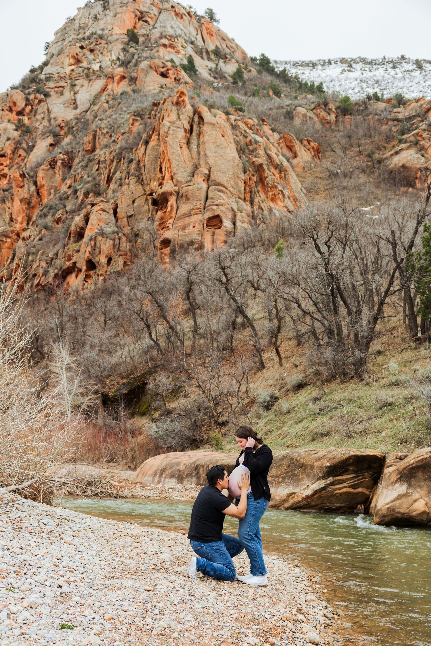 Pregnant woman and husband at The Red Ledges picnic area photography by Av Potter Photo a Utah wedding and lifestyle photographer