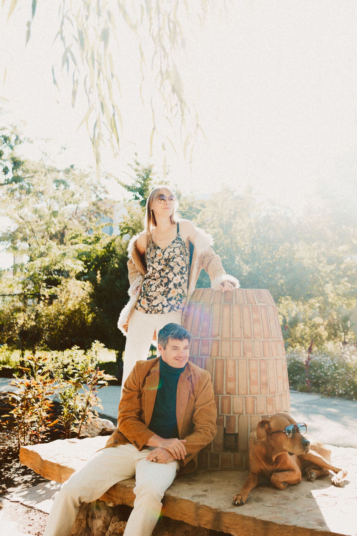 Couple with dog at Gigal Sculpture Garden photography by Av Potter Photo a Utah wedding and lifestyle photographer