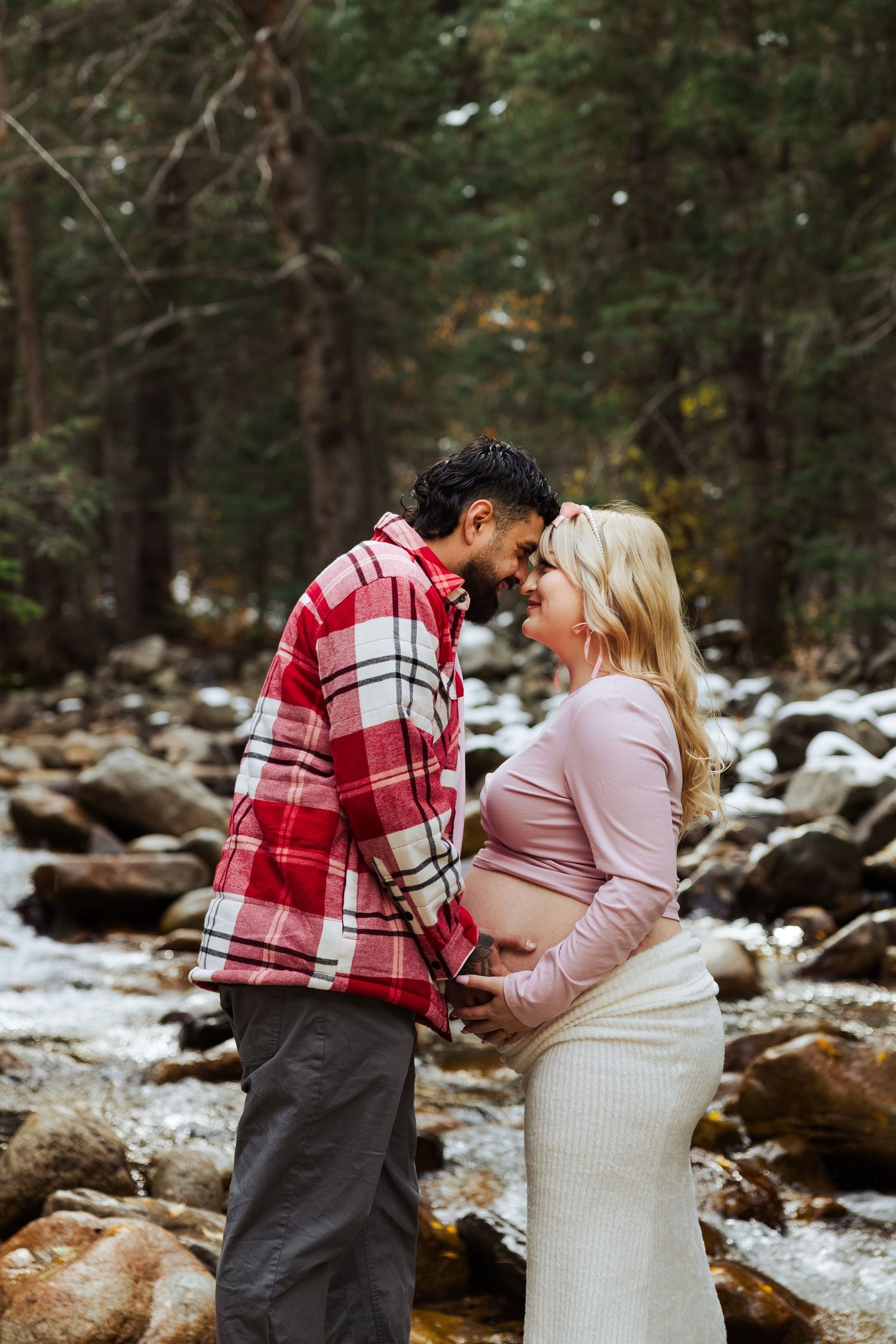 Pregnant woman with husband at Little Cottonwood Trail photography by Av Potter Photo a Utah wedding and lifestyle photographer