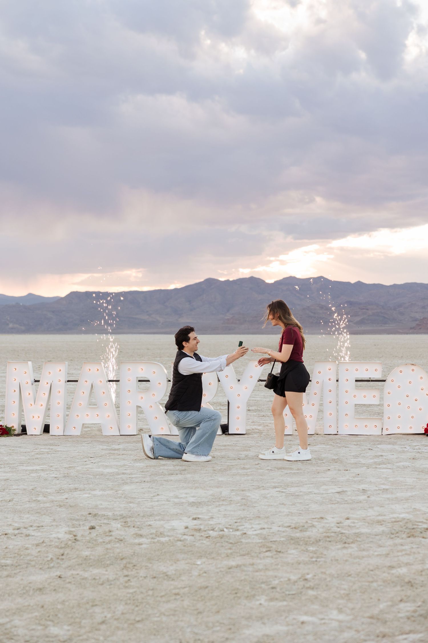 Proposal at The Bonneville Salt Flats photography by Av Potter Photo a Utah wedding and lifestyle photographer