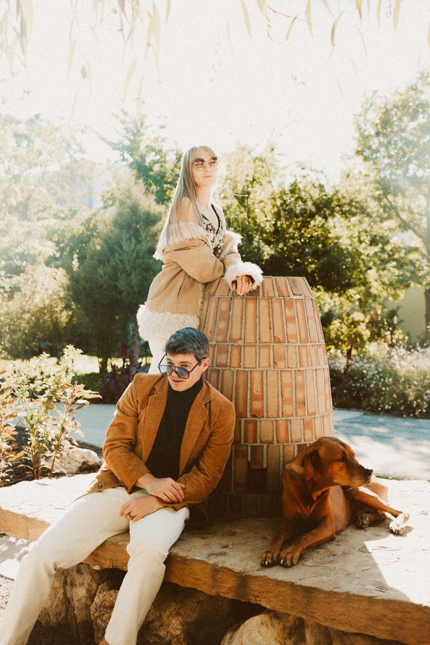 Couple with dog at Gigal Sculpture Garden photography by Av Potter Photo a Utah wedding and lifestyle photographer