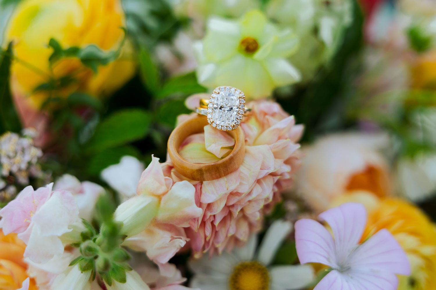 Wedding rings in flowers at Silver Lake photography by Av Potter Photo a Utah wedding and lifestyle photographer