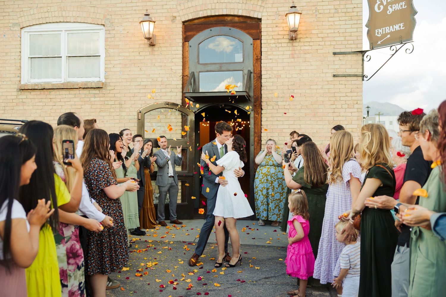Bride and groom during send off at The Startup Building photography by Av Potter Photo a Utah wedding and lifestyle photographer