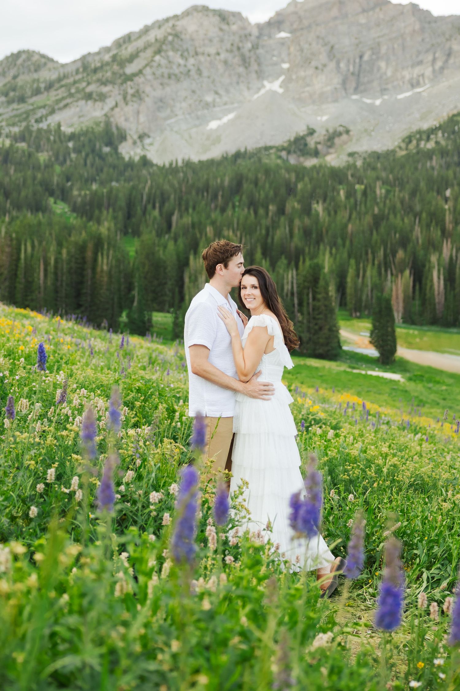 Couple in flower field at Albion Basin photography by Av Potter Photo a Utah wedding and lifestyle photographer