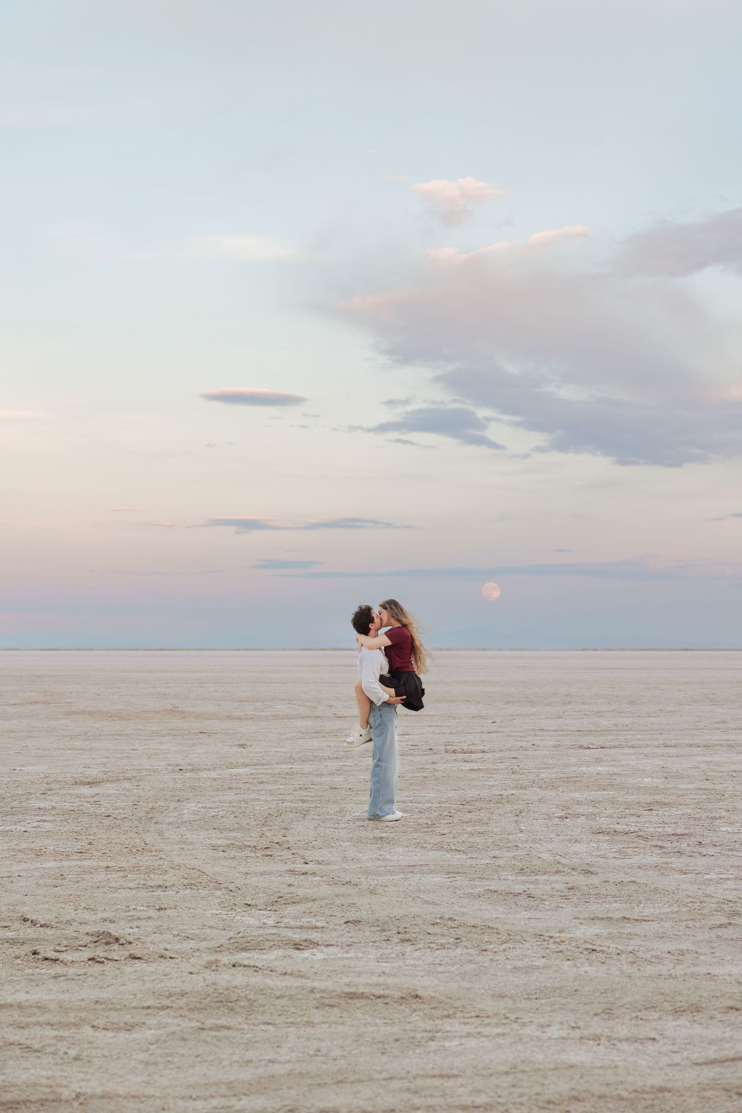 Couple at The Bonneville Salt Flats photography by Av Potter Photo a Utah wedding and lifestyle photographer