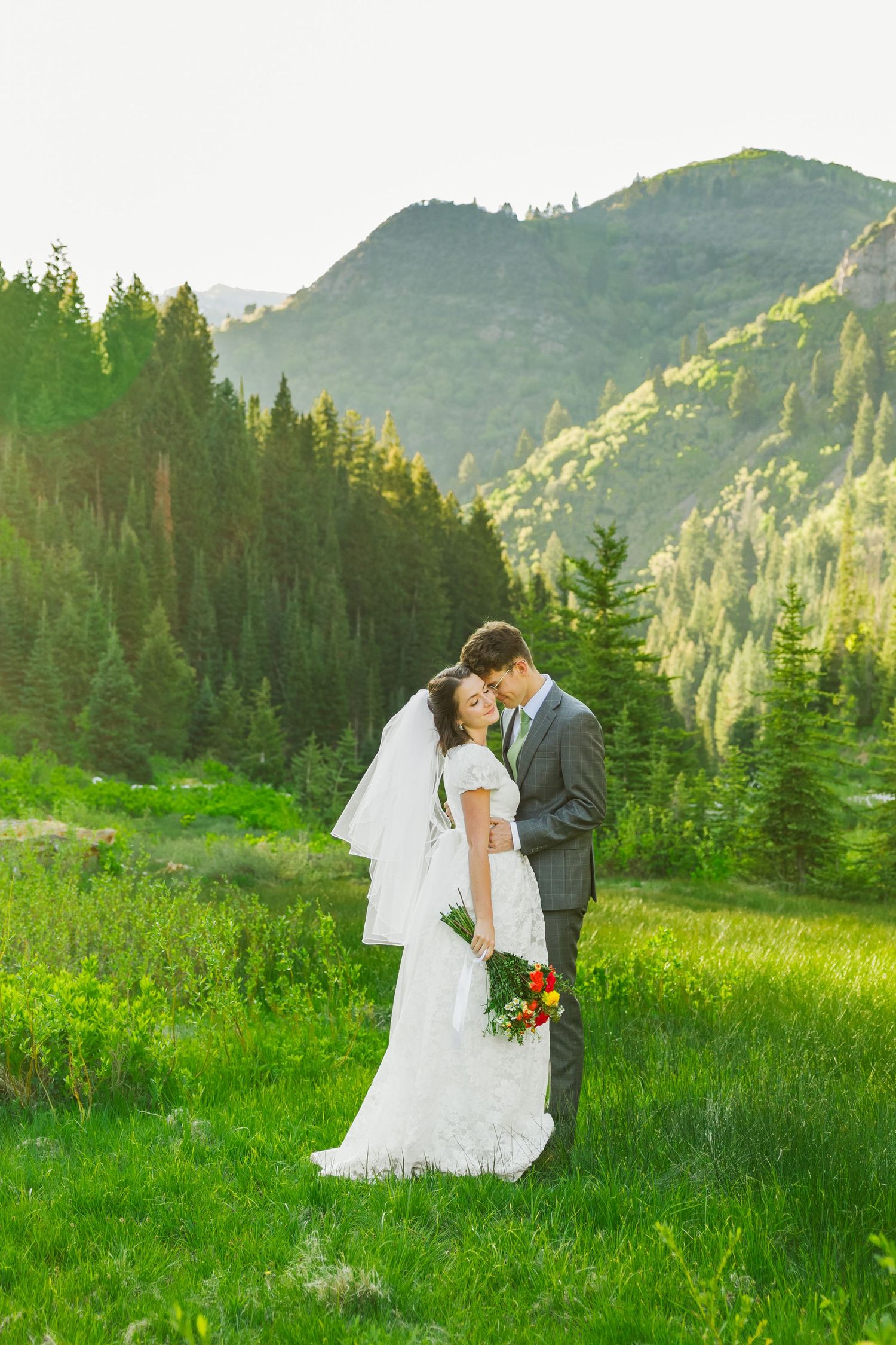 Bride and groom in field at Jordan Pines Campground photography by Av Potter Photo a Utah wedding and lifestyle photographer
