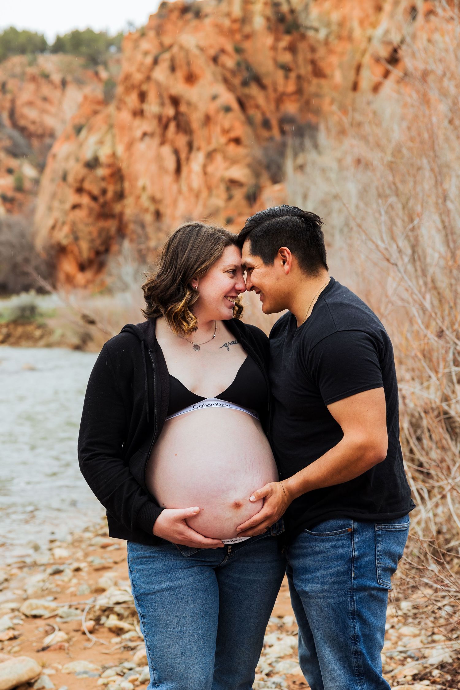 Pregnant woman and husband at The Red Ledges picnic area photography by Av Potter Photo a Utah wedding and lifestyle photographer