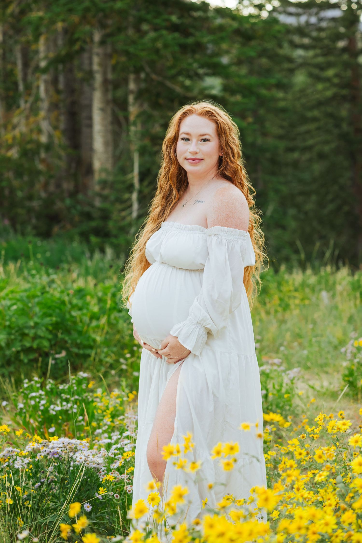 Pregnant women in flower field at Albion Basin photography by Av Potter Photo a Utah wedding and lifestyle photographer