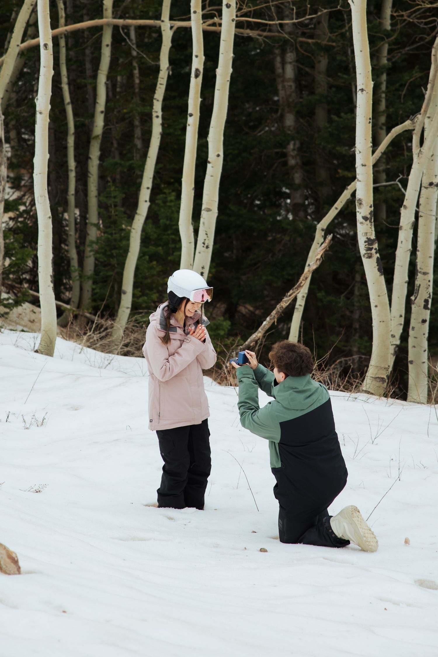 Winter proposal in ski attire at Snowbird Resort photography by Av Potter Photo a Utah wedding and lifestyle photographer