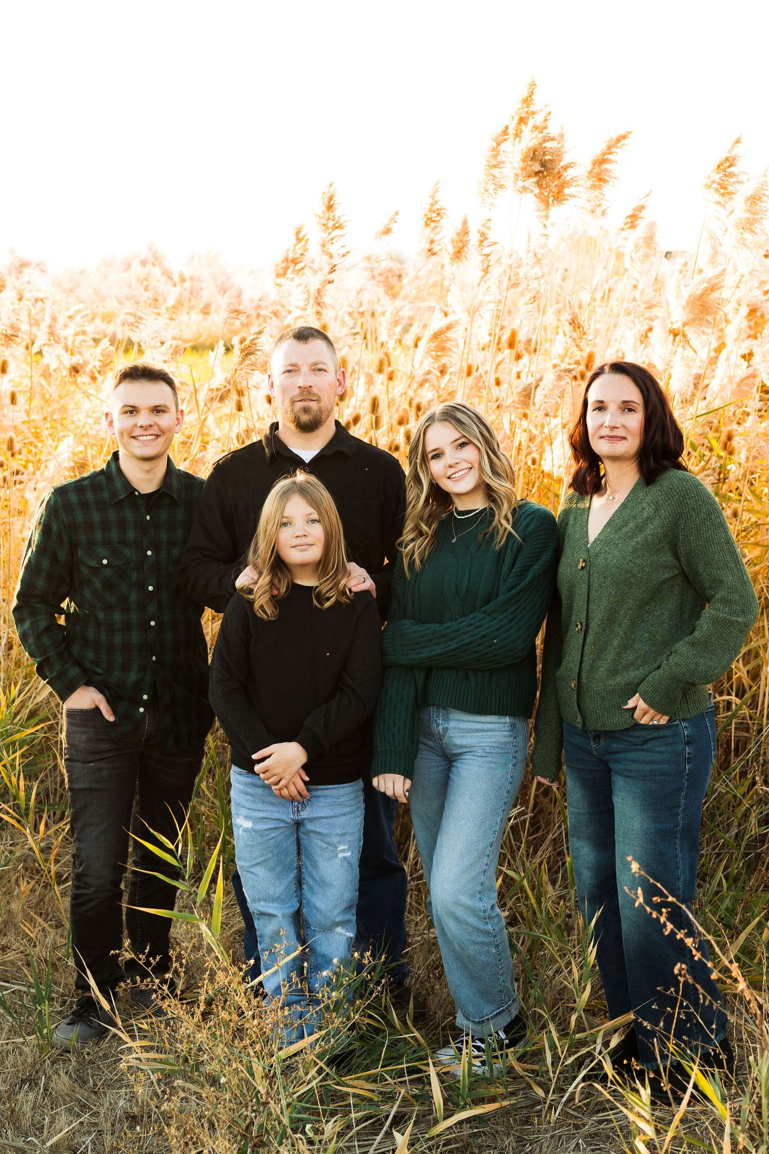 Family in field at Jensen Nature Park photography by Av Potter Photo a Utah wedding and lifestyle photographer
