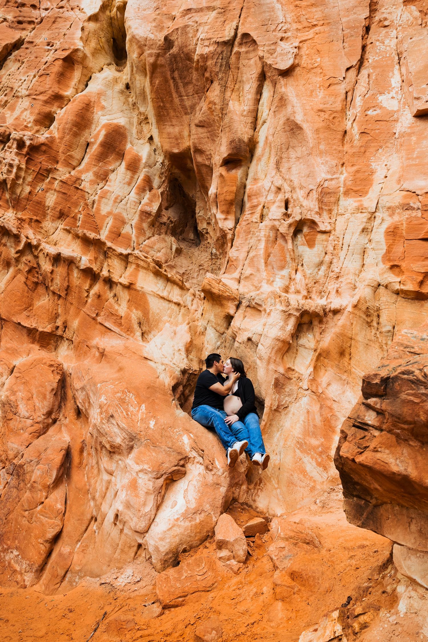 Pregnant woman and husband at The Red Ledges picnic area photography by Av Potter Photo a Utah wedding and lifestyle photographer