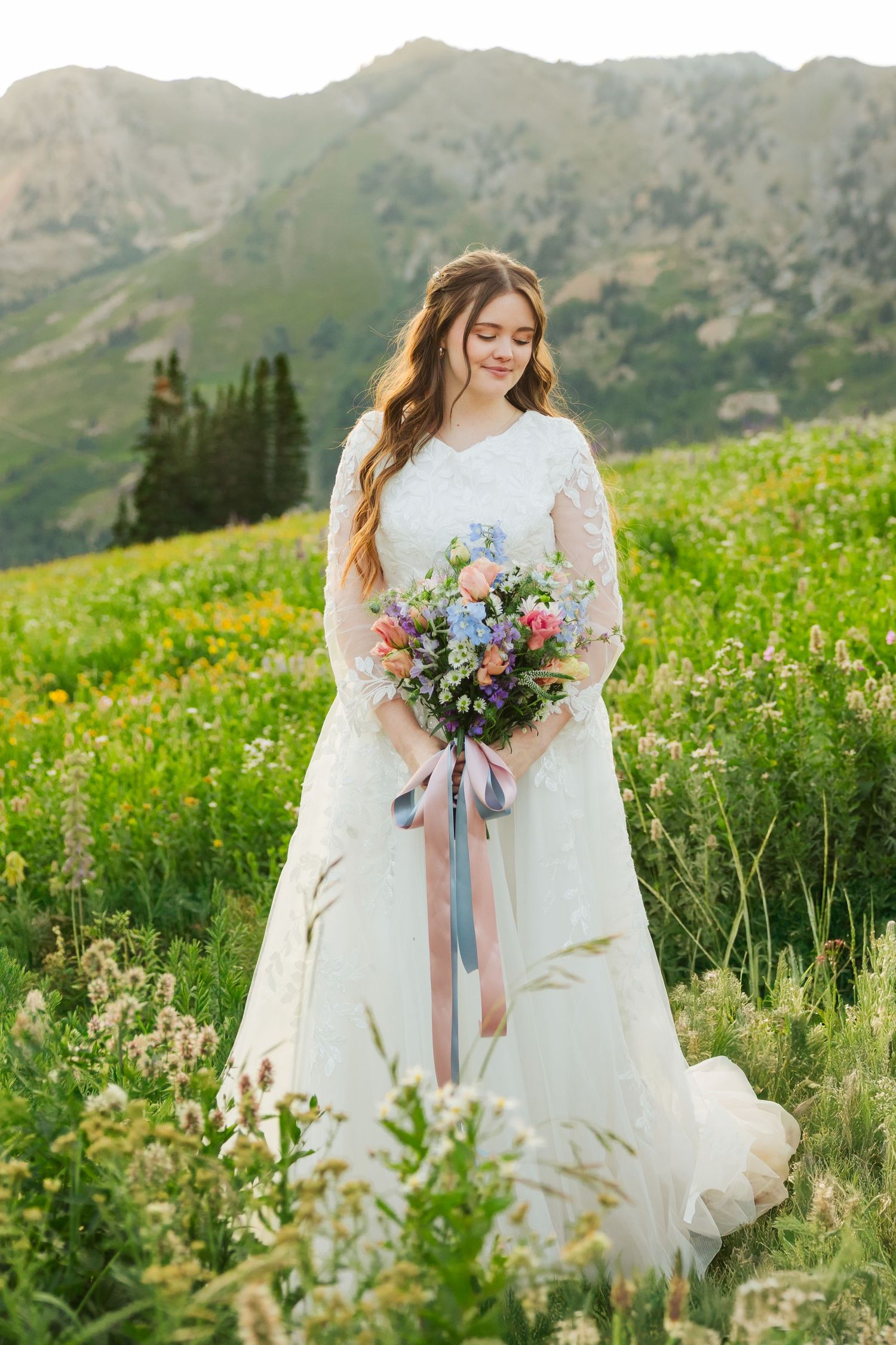 Bride in flower field at Albion Basin photography by Av Potter Photo a Utah wedding and lifestyle photographer