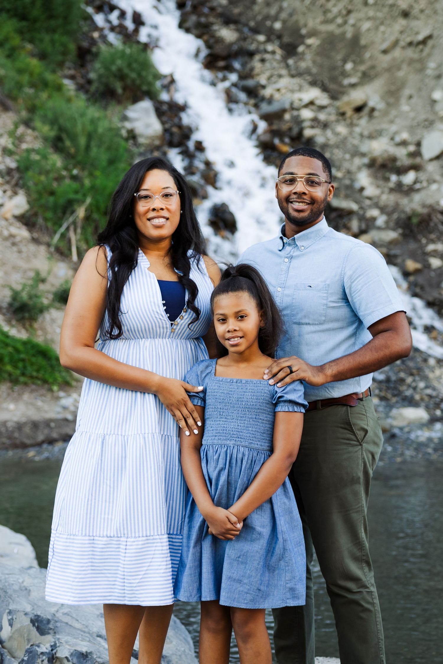 Family in front of Bridal Veil Falls photography by Av Potter Photo a Utah wedding and lifestyle photographer
