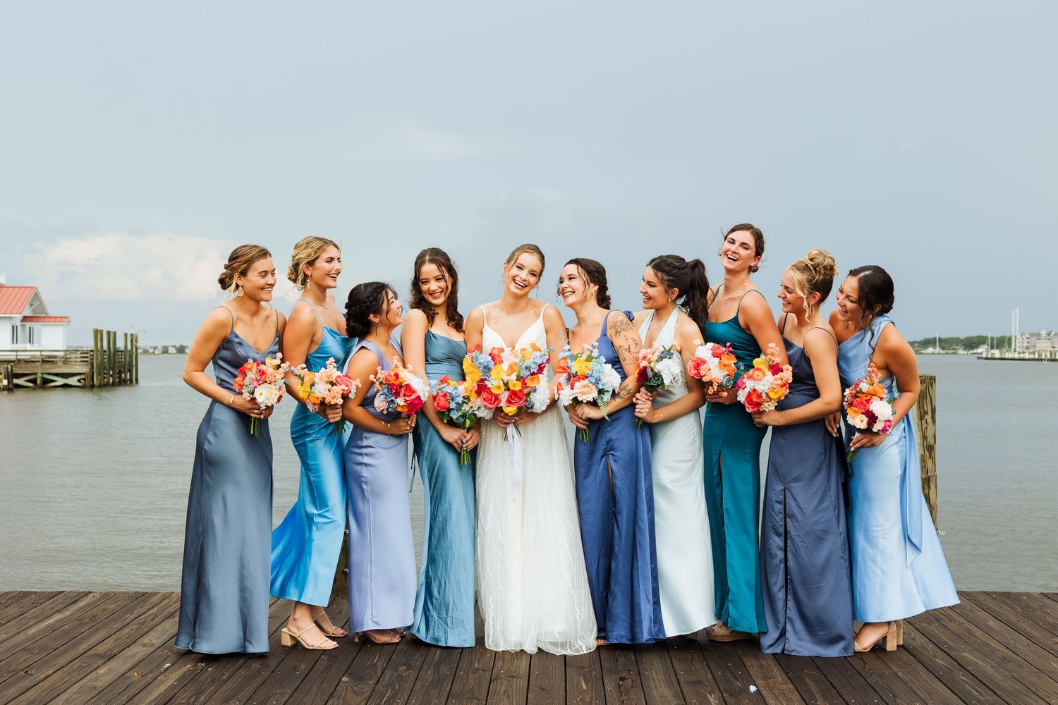 Bridal party on dock at Manteo North Carolina photography by Av Potter Photo a Utah wedding and lifestyle photographer