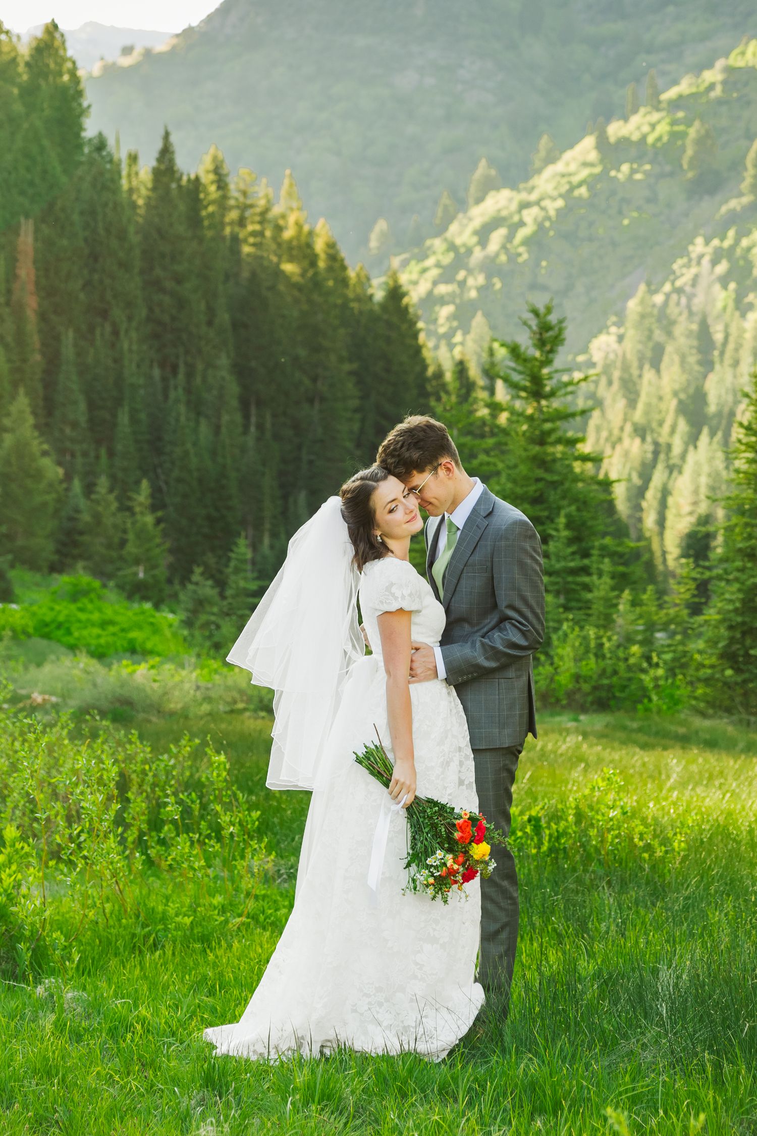 Bride and groom in field at Jordan Pines Campground photography by Av Potter Photo a Utah wedding and lifestyle photographer