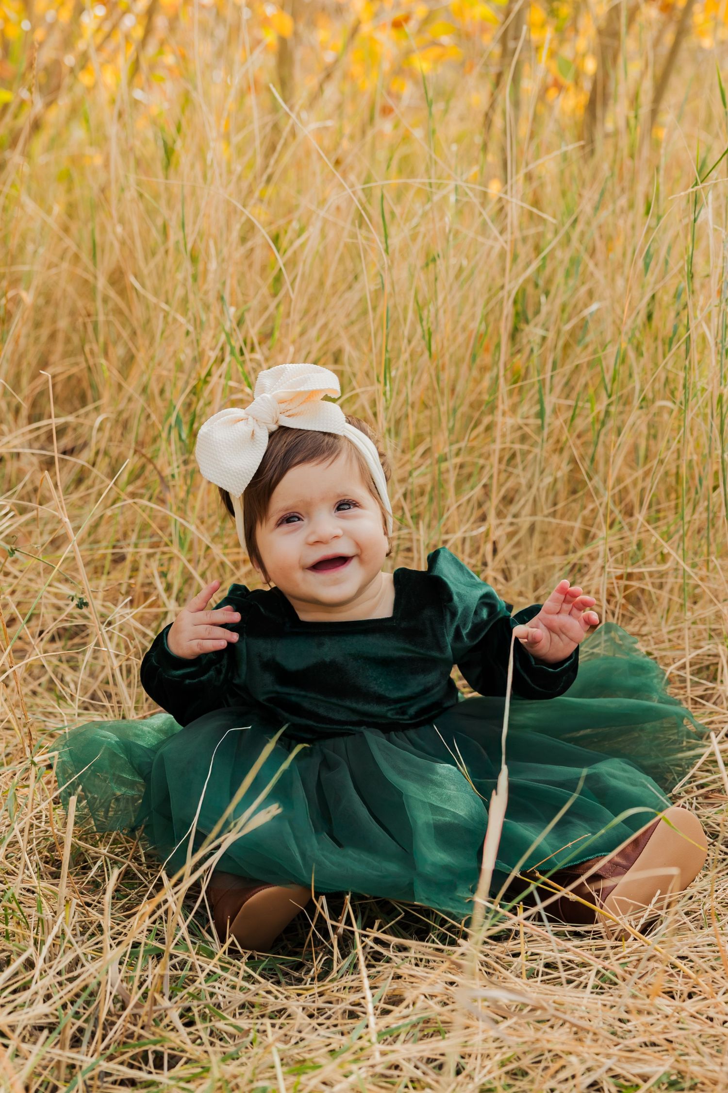 Baby girl sitting at Neff's Canyon during fall photography by Av Potter Photo a Utah wedding and lifestyle photographer