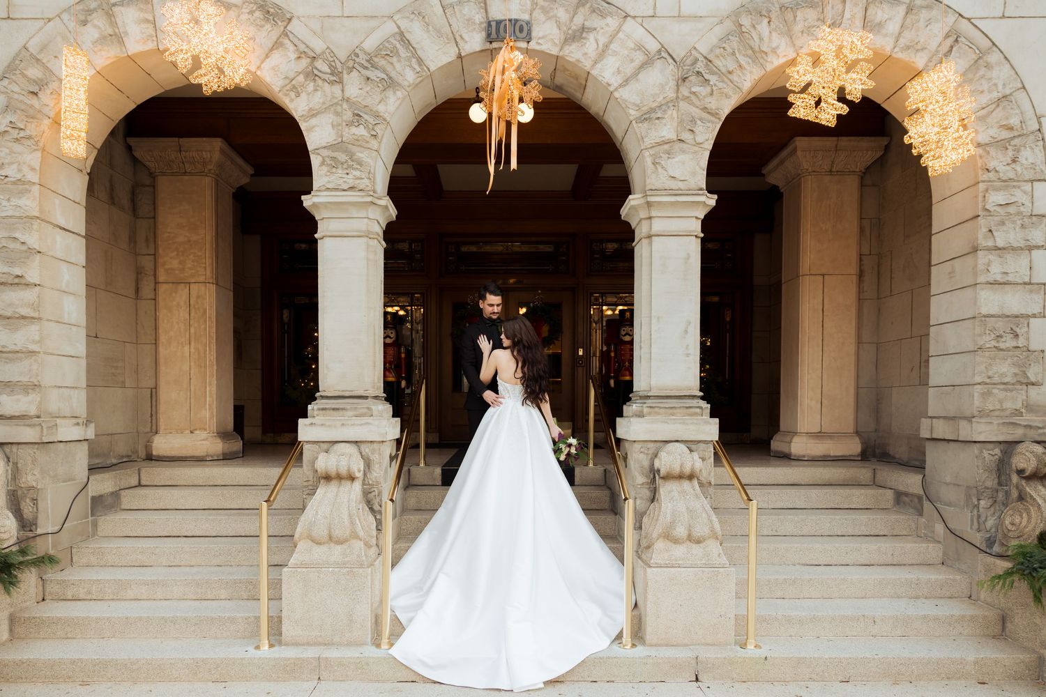 Bride and groom on stairs at The Alta Club photography by Av Potter Photo a Utah wedding and lifestyle photographer