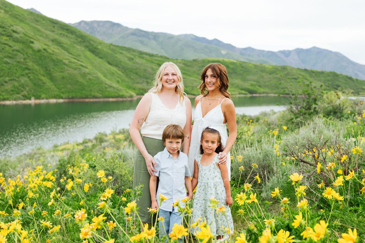 Family in flower field at Little Dell Reservoir photography by Av Potter Photo a Utah wedding and lifestyle photographer