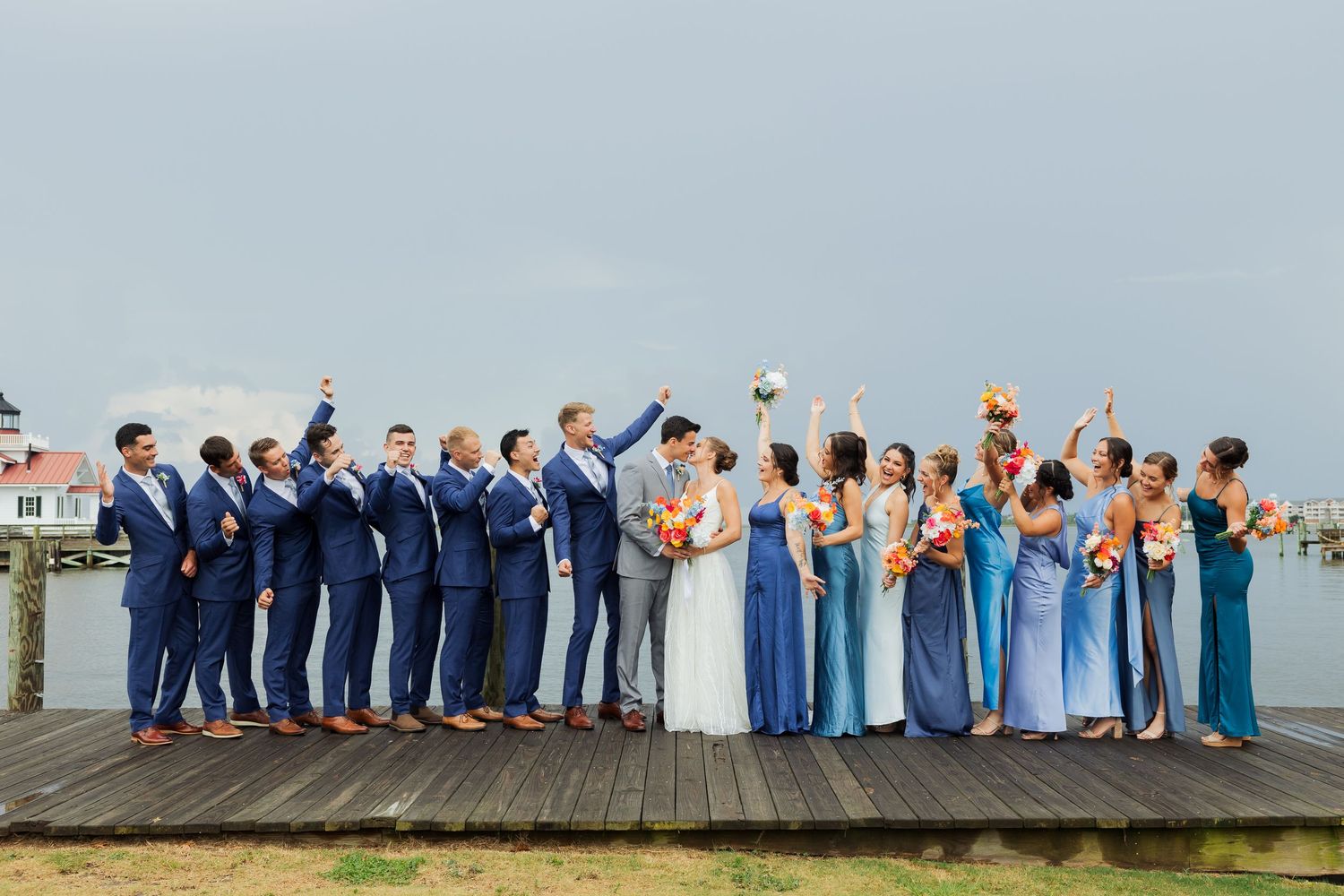 Bridal party on deck of Manteo North Carolina photography by Av Potter Photo a Utah wedding and lifestyle photographer