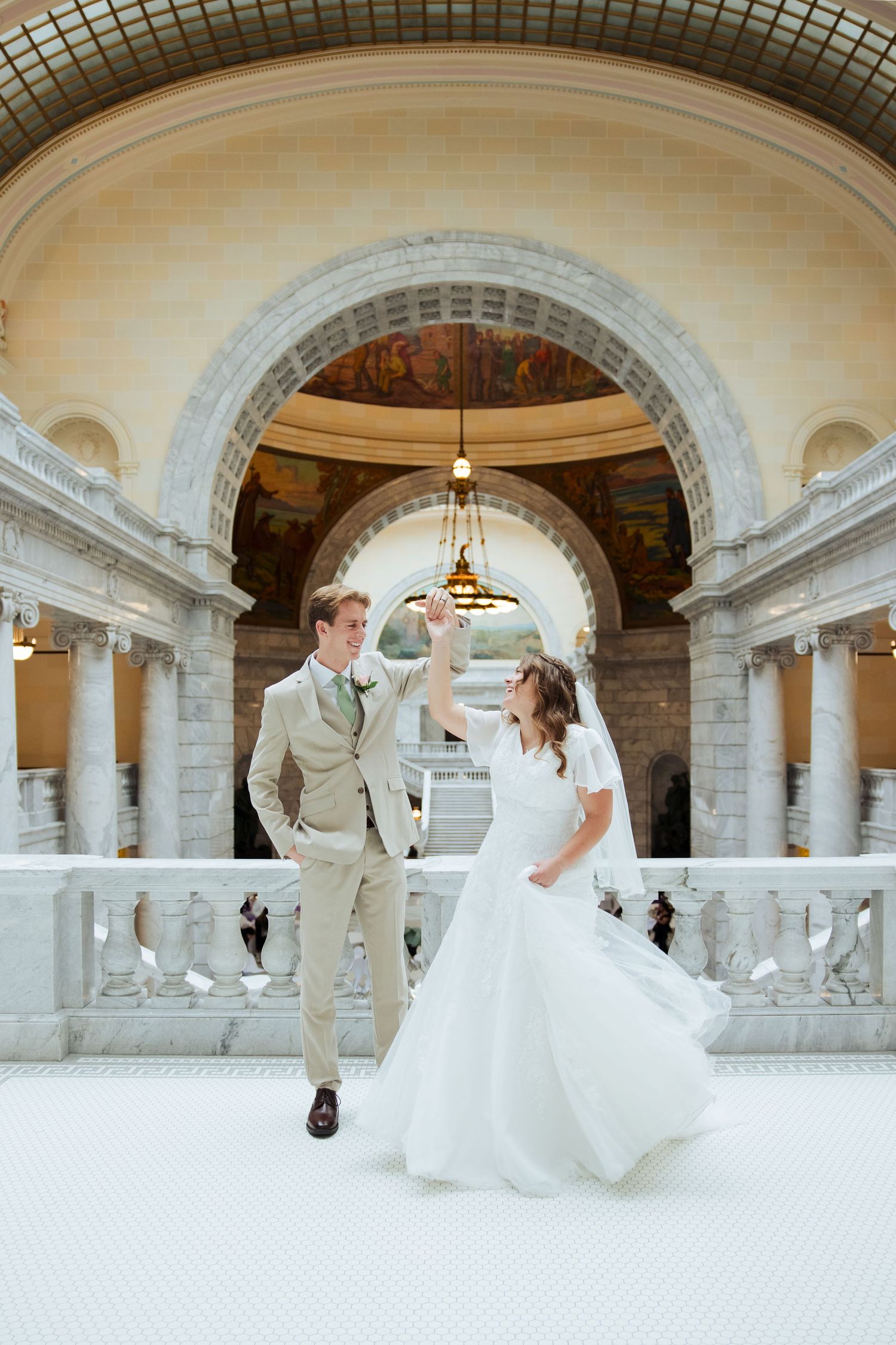 Bride and groom dancing at The Utah State Capitol photography by Av Potter Photo a Utah wedding photographer