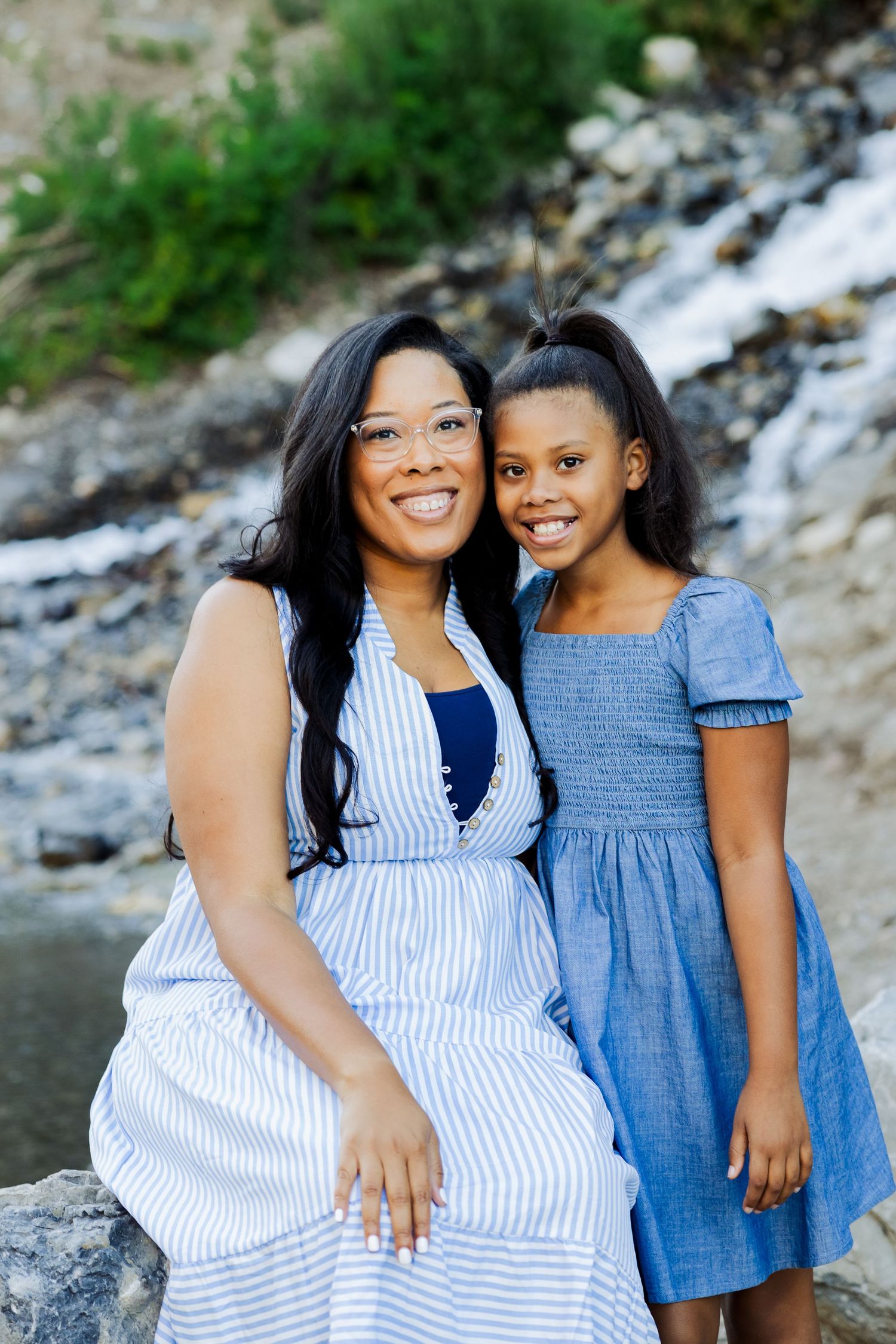 Mother and daughter in front of Bridal Veil Falls photography by Av Potter Photo a Utah wedding and lifestyle photographer
