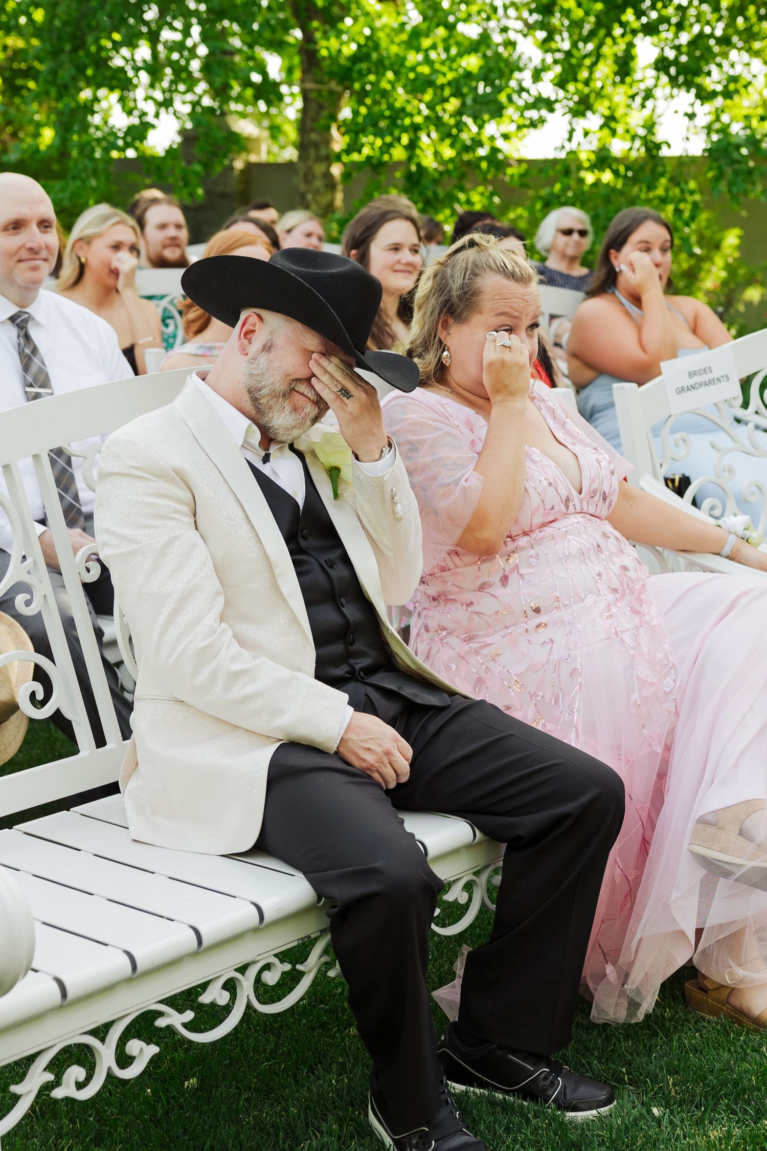 Wedding guests crying during ceremony at Millennail Falls photography by Av Potter Photo a Utah wedding and lifestyle photographer
