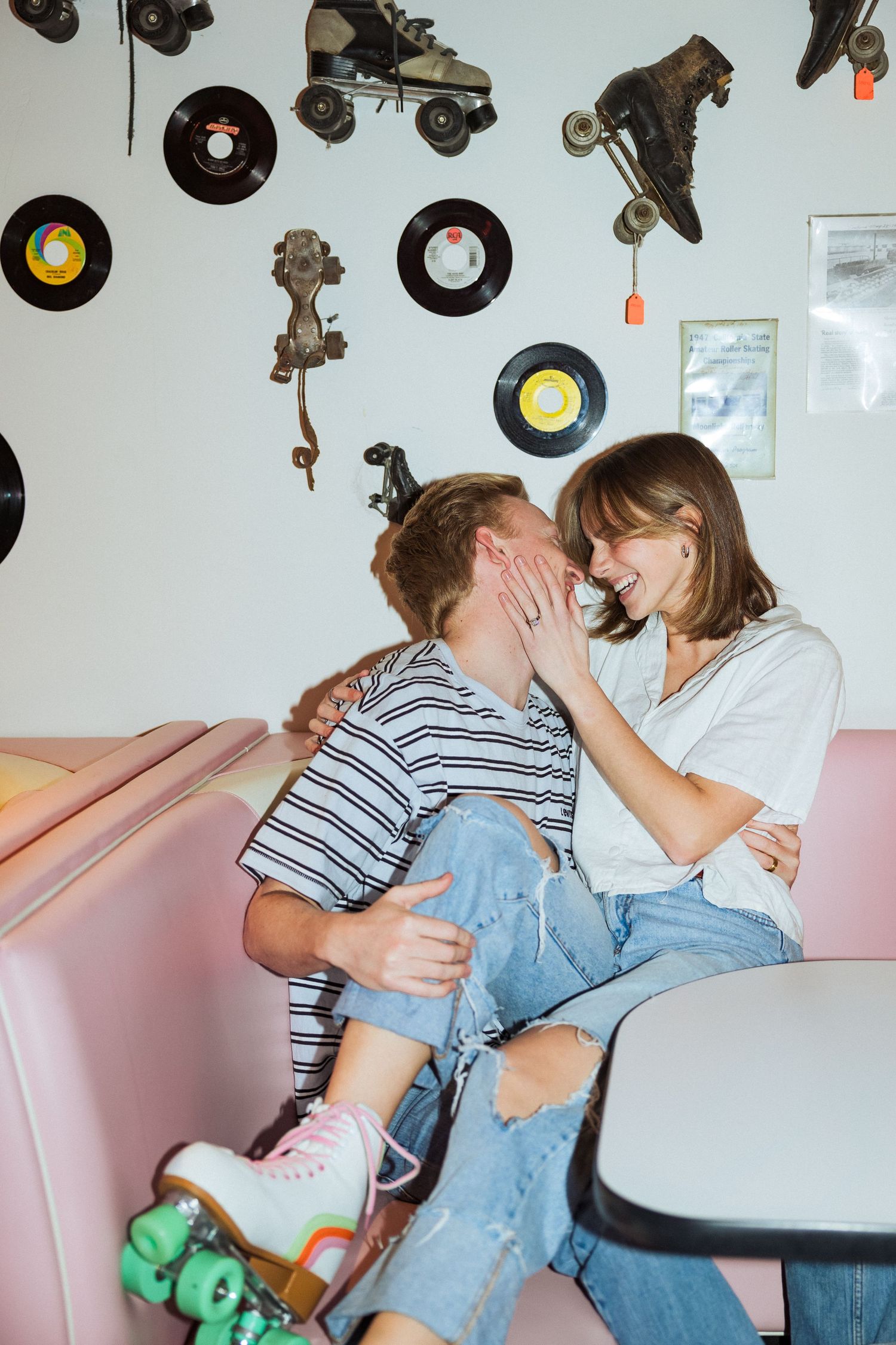 Couple sitting in diner at Classic Skating in Orem photography by Av Potter Photo a Utah wedding and lifestyle photographer