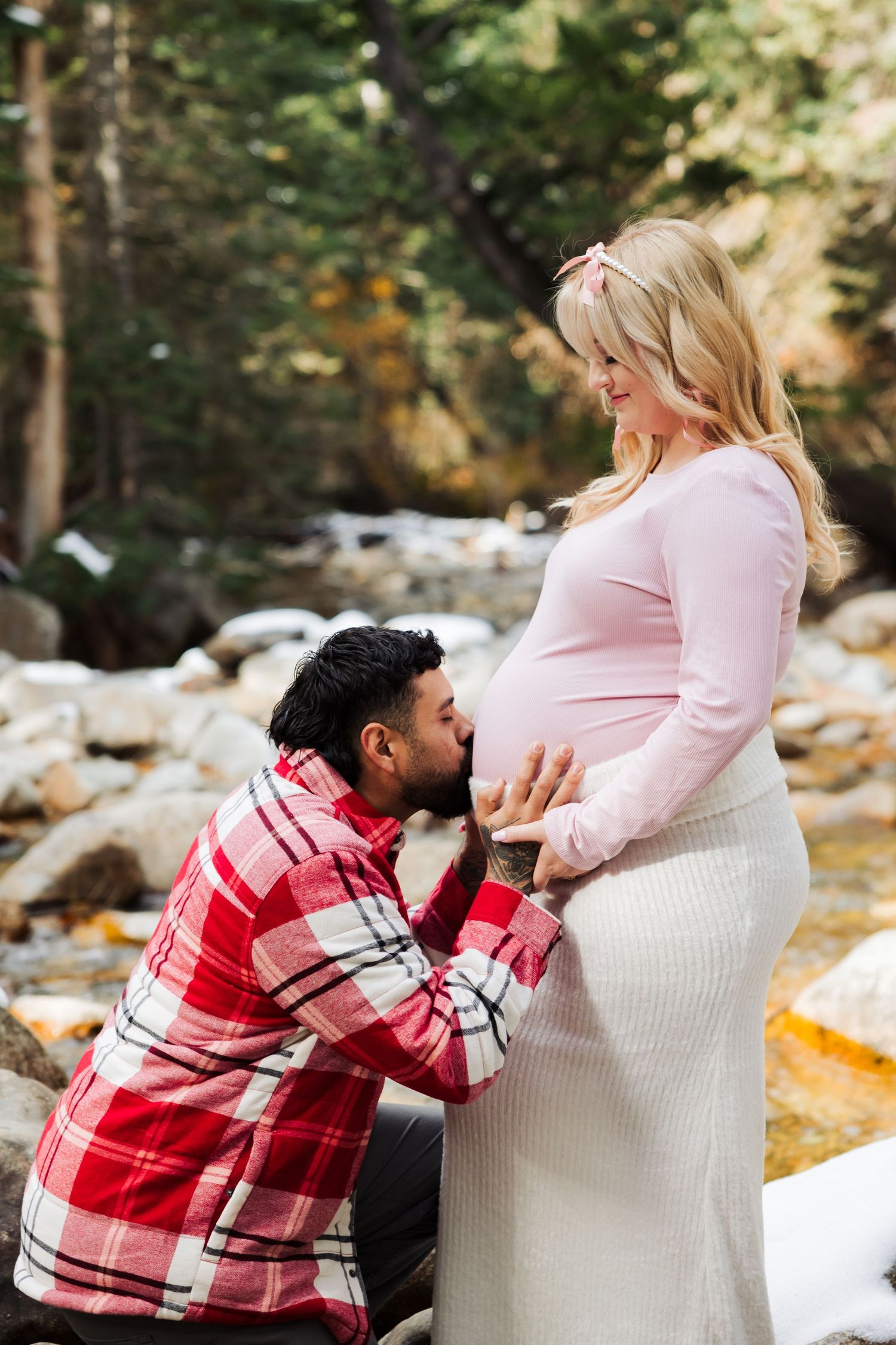 Pregnant woman with husband at Little Cottonwood Trail photography by Av Potter Photo a Utah wedding and lifestyle photographer