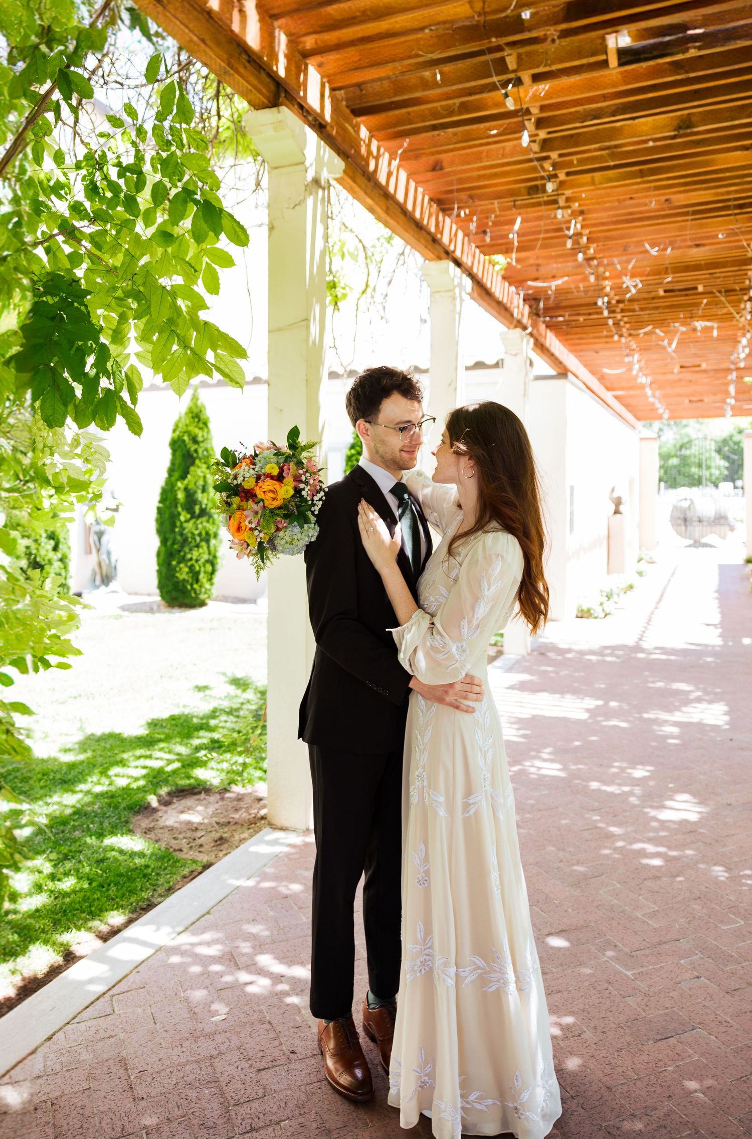 Bride and groom at the Springville Art Museum photography by Av Potter Photo a Utah wedding and lifestyle photographer