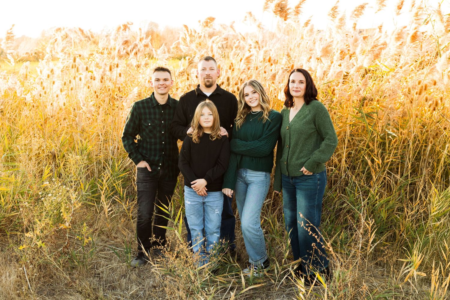 Family in field at Jensen Nature Park photography by Av Potter Photo a Utah wedding and lifestyle photographer