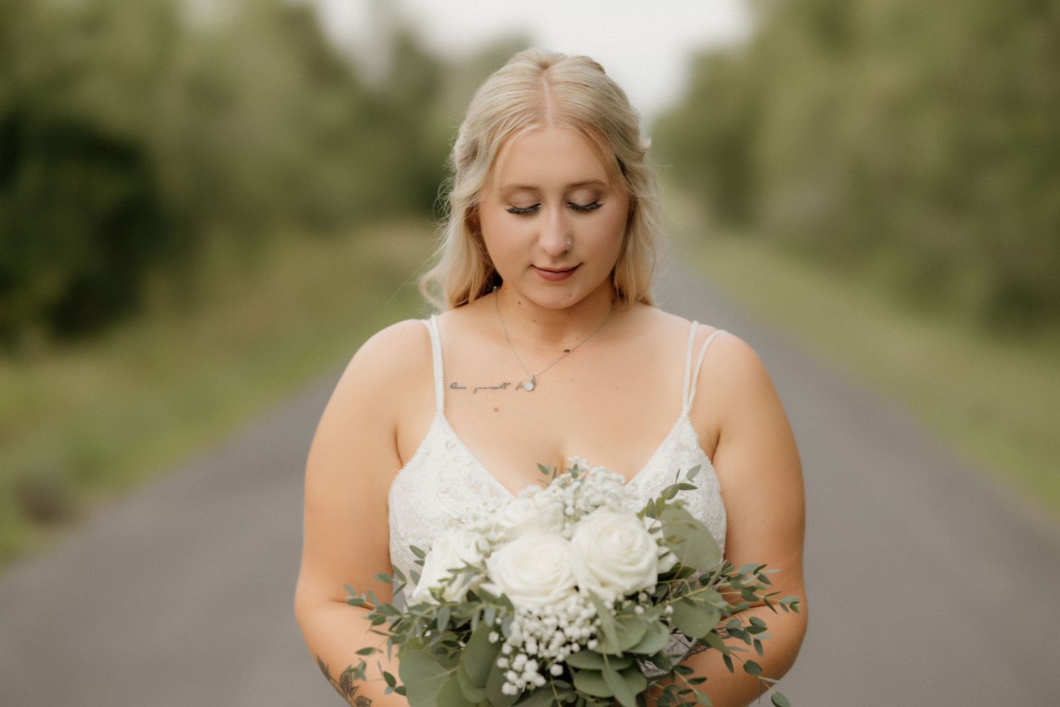 Wedding bouquet detail shot featuring white flowers and eucalyptus greenery.
