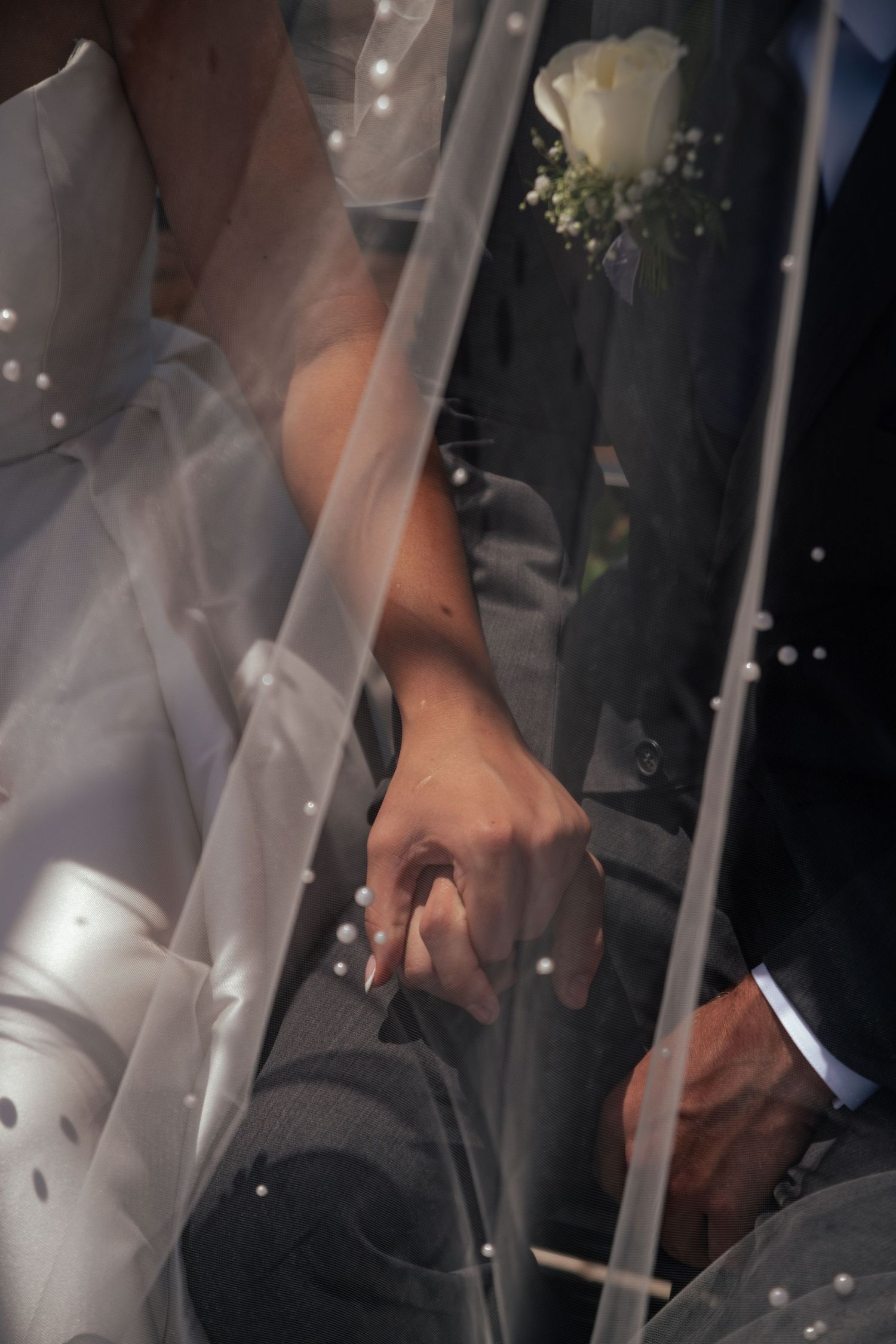 Close-up view of hands adjusting equipment in dim lighting conditions.