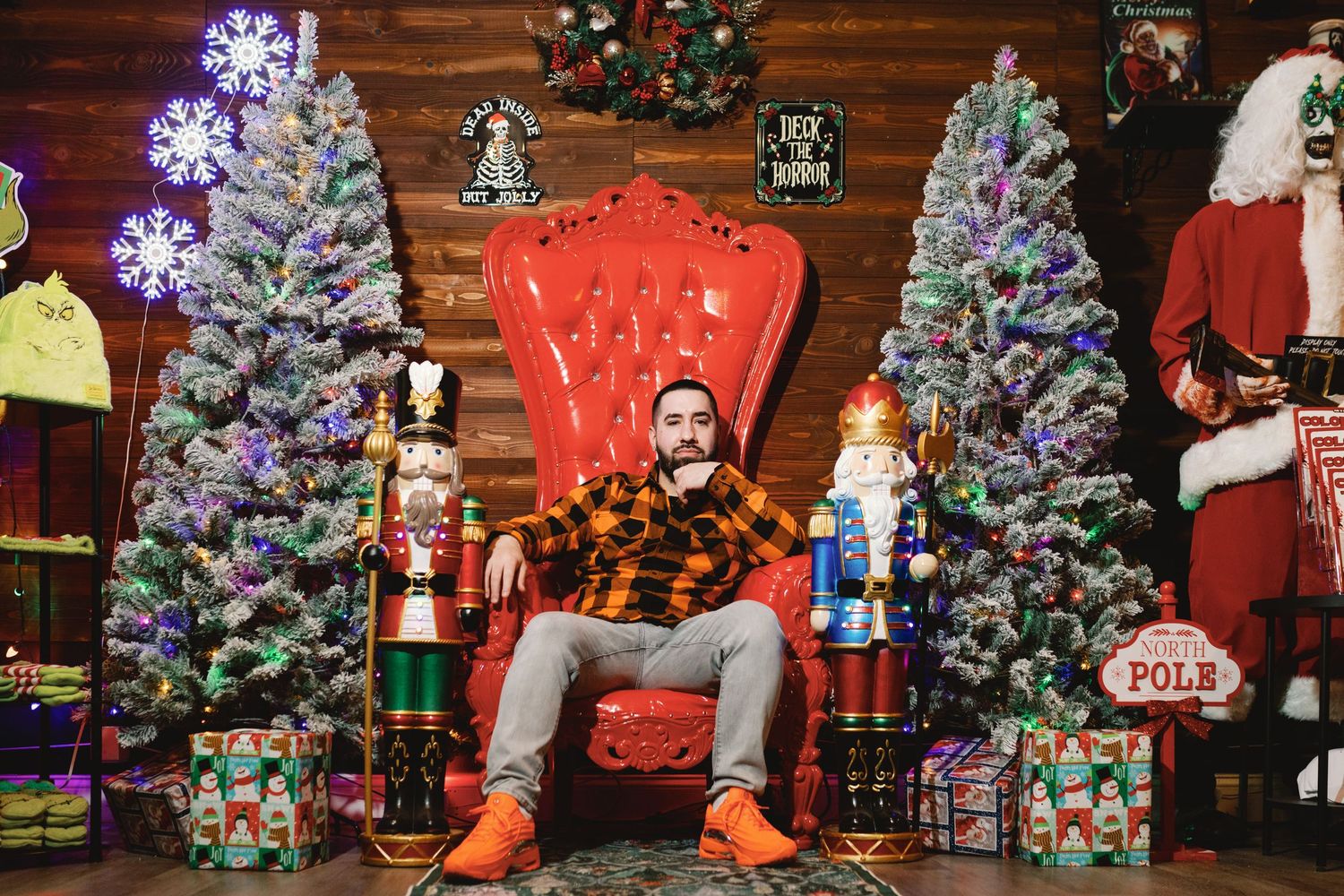 A festive holiday scene with multiple decorated Christmas trees, nutcracker figures, and seasonal decor in a warm setting.