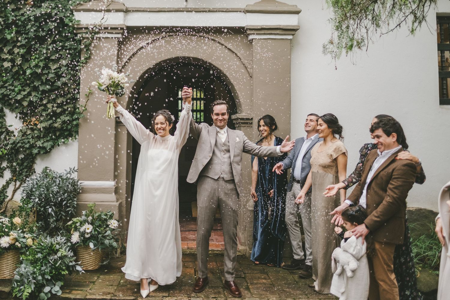A collage of wedding celebration moments showing guests dancing and celebrating at an elegant outdoor venue.