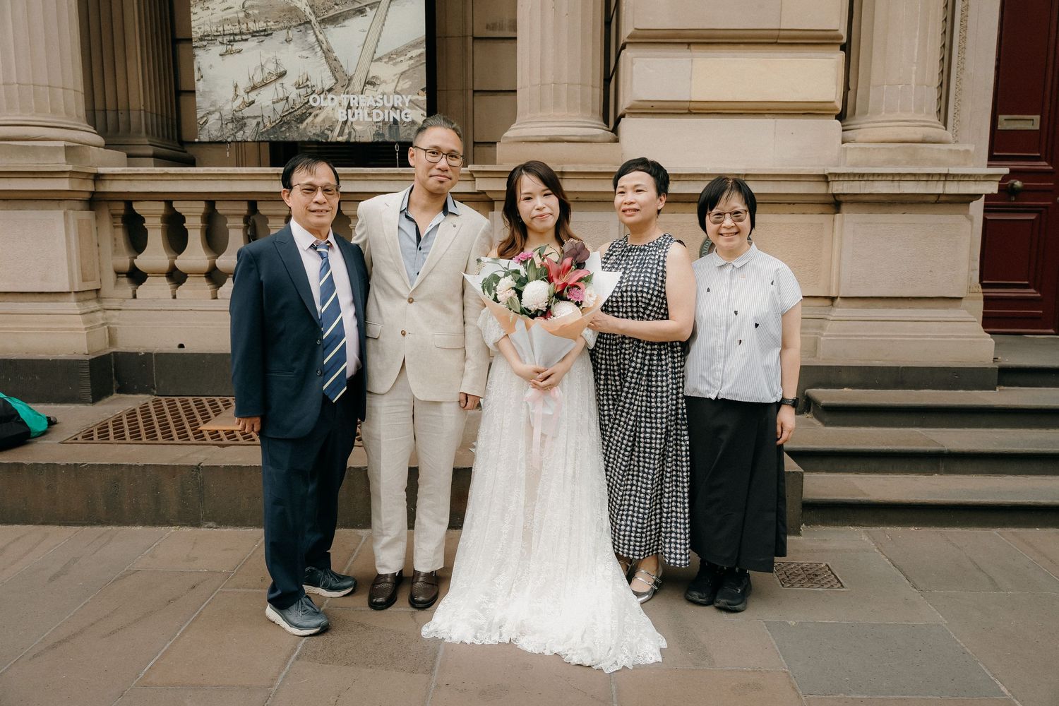 A series of wedding photos showing guests and a bride's white dress on stone steps of an elegant building.
