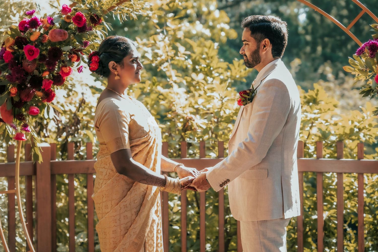 A romantic wedding ceremony takes place in a garden setting with red roses and golden sunlight streaming through.