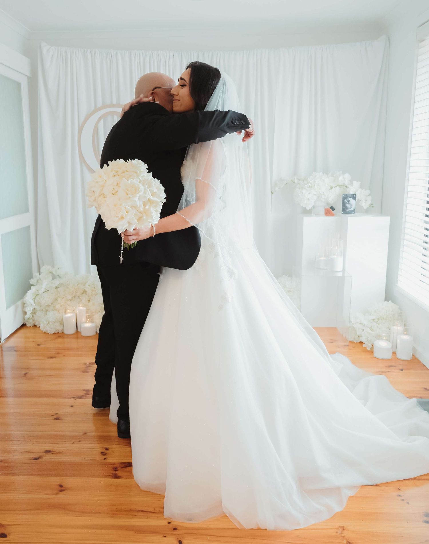 A romantic black and white wedding photograph sequence showing a couple embracing in four similar frames.