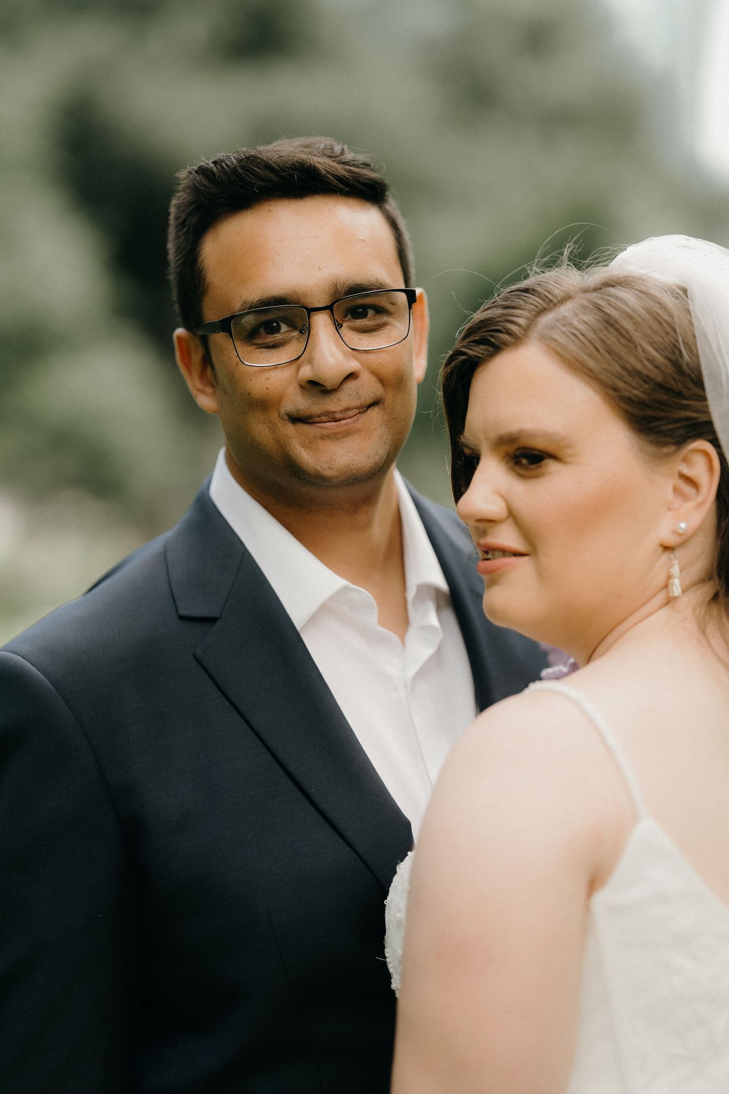 A romantic wedding photo series showing a couple in formal attire sharing intimate moments together.