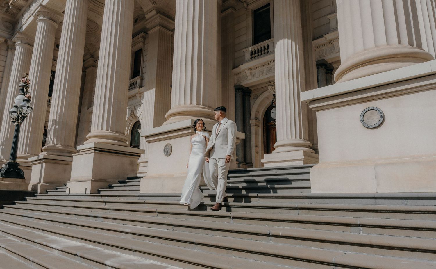 Classical stone columns and steps create an elegant architectural perspective at a historic building entrance.