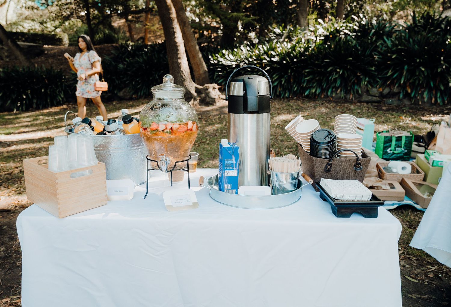 A collage of outdoor wedding celebration scenes with rustic decor, tables, and natural settings in warm sunlight.
