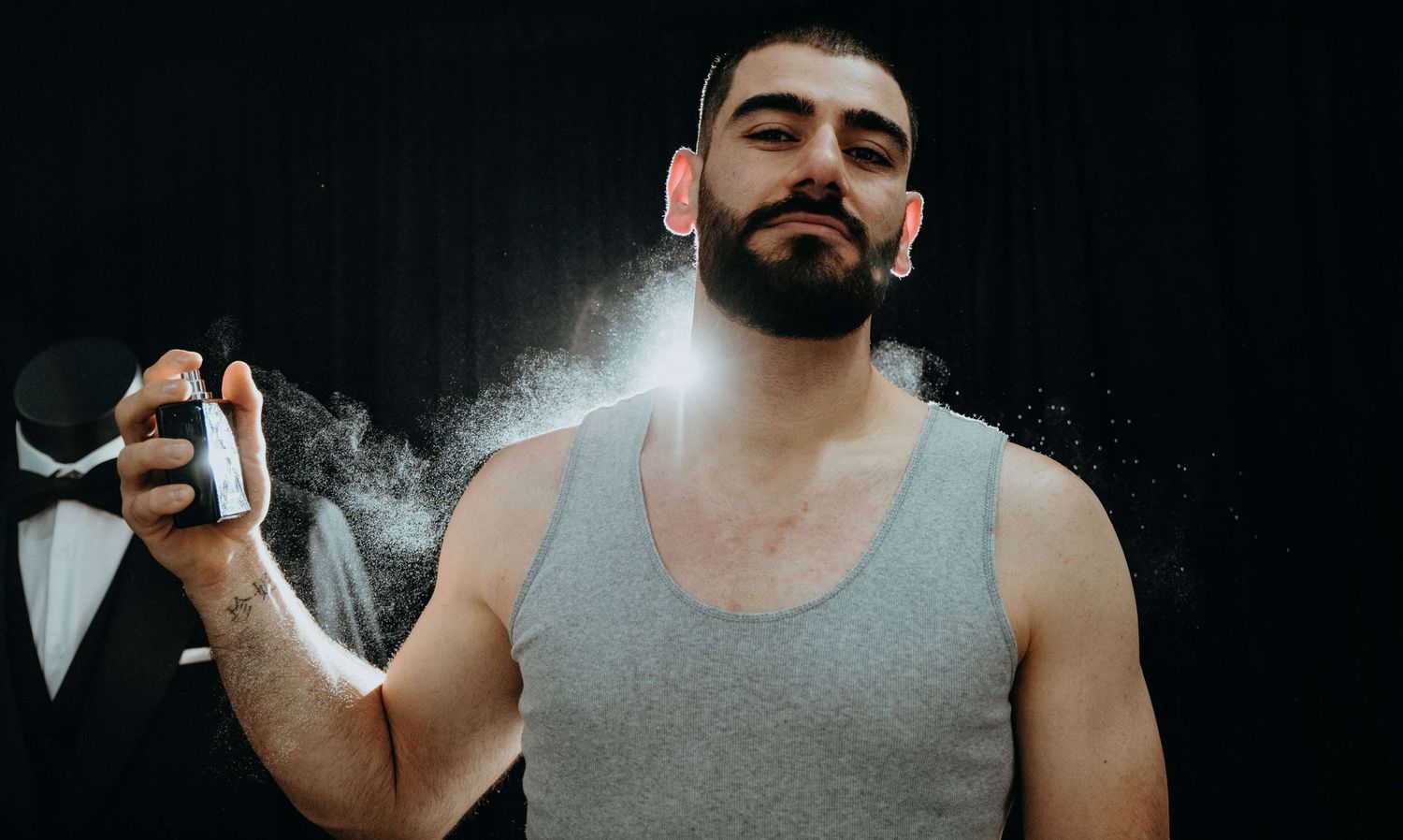 Person in a dark room taking moody selfies with dramatic shadows and lighting effects.