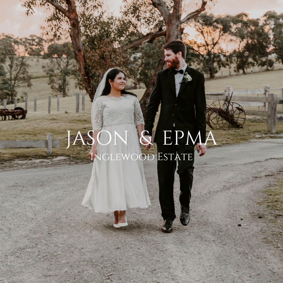 Newlywed couple walking together on a country estate with rustic charm at sunset.