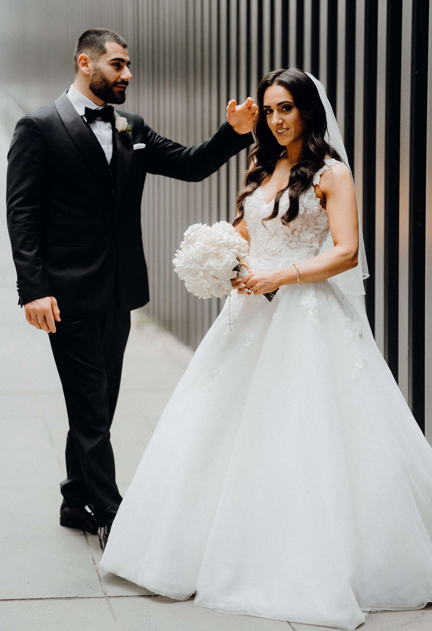 Stylish black and white collage shows newlywed couples dancing and embracing against modern striped wall backdrop.