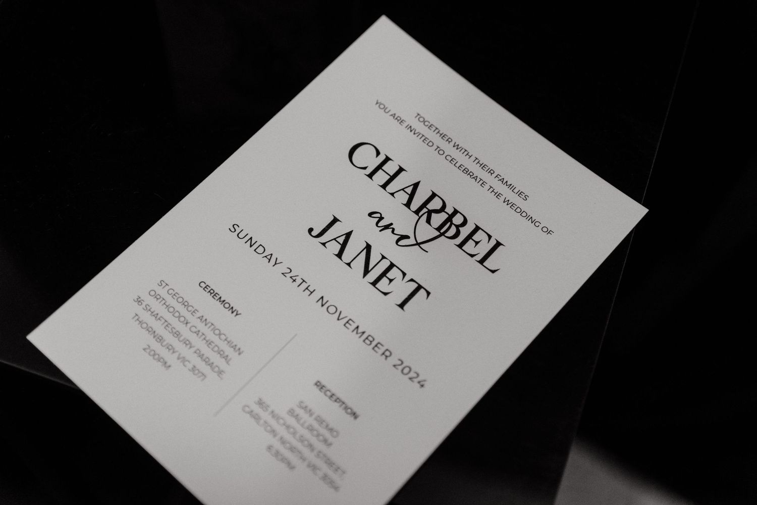 A series of white business cards or paper documents arranged in a horizontal layout against a dark background.
