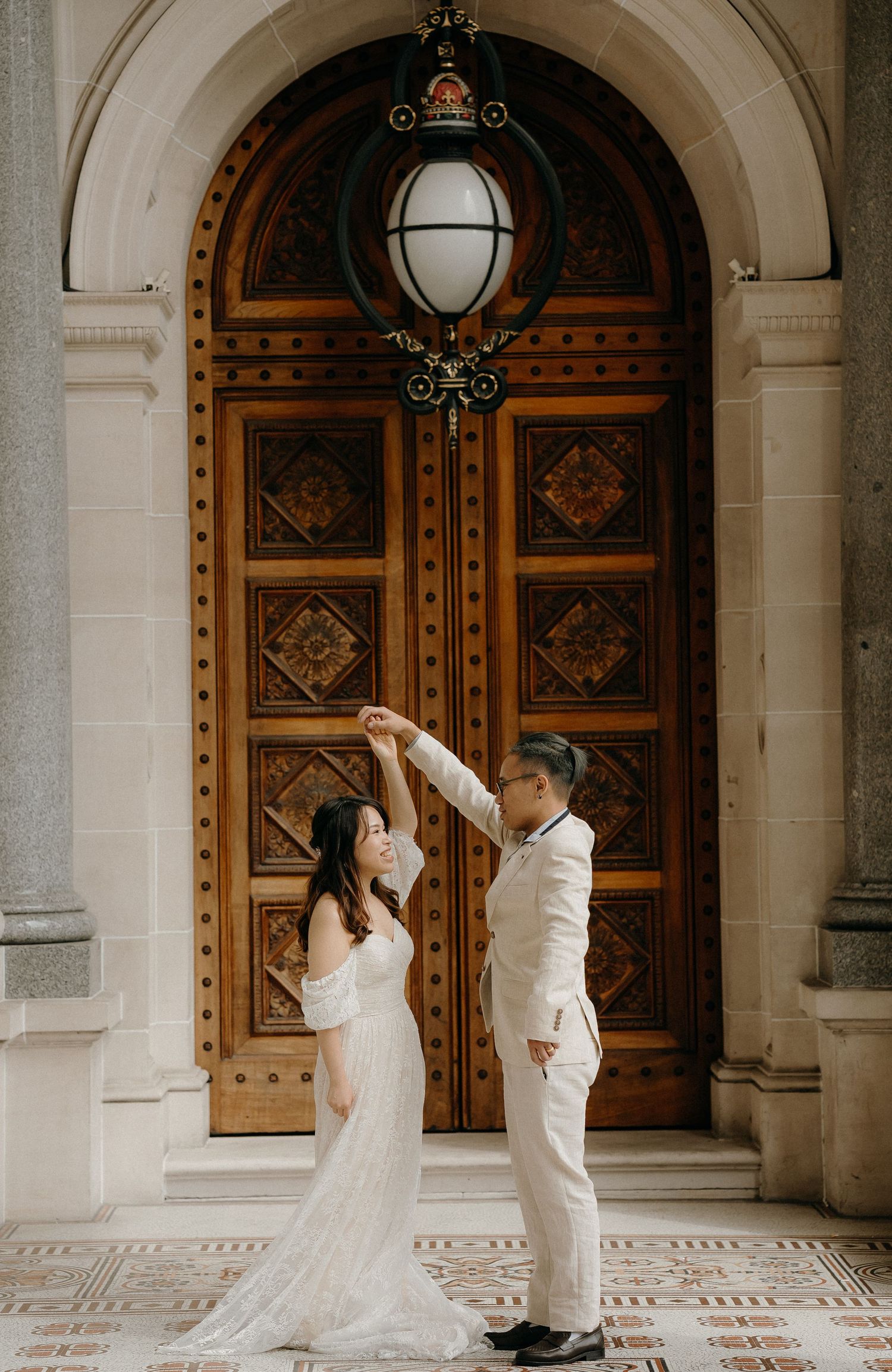 A romantic sequence of wedding photos showing a couple dancing in front of ornate wooden doors at a historic building.