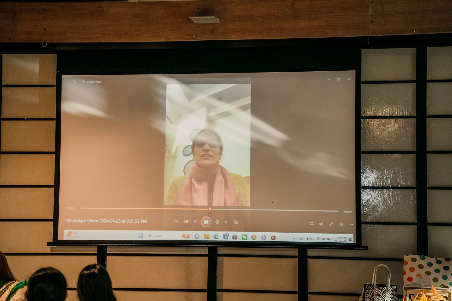 A collage of video conference screens showing multiple participants in a virtual meeting setup.