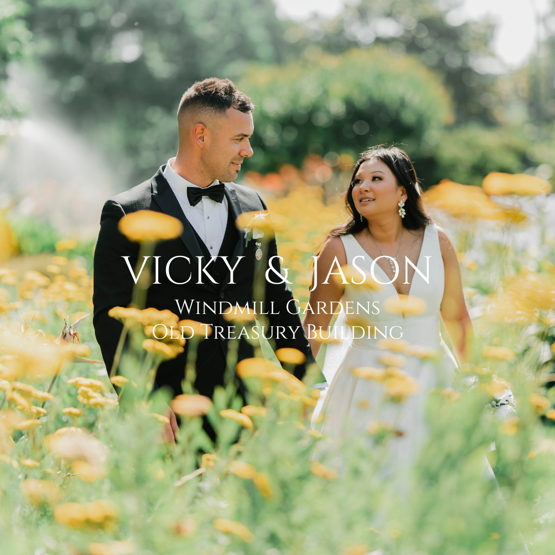 Couple laughing together in garden filled with yellow wildflowers.
