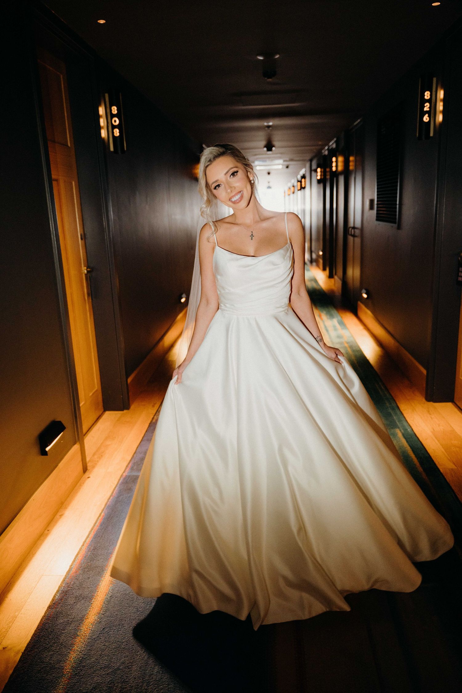 A bride in a white ball gown twirls in a dimly lit hallway creating a dramatic spinning effect in multiple frames.
