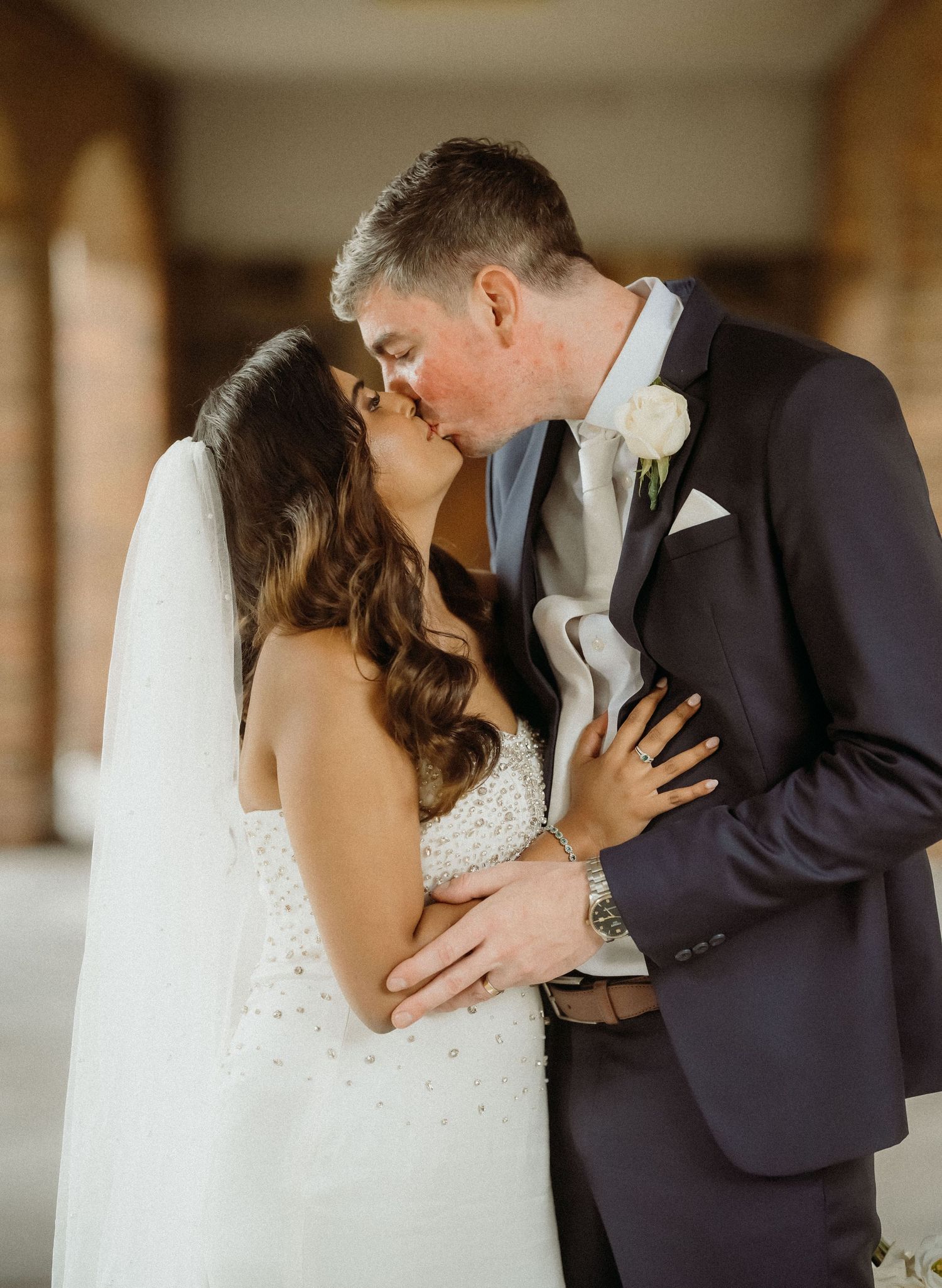 Romantic wedding couple sharing intimate kisses in a sequence of four connected photographs.